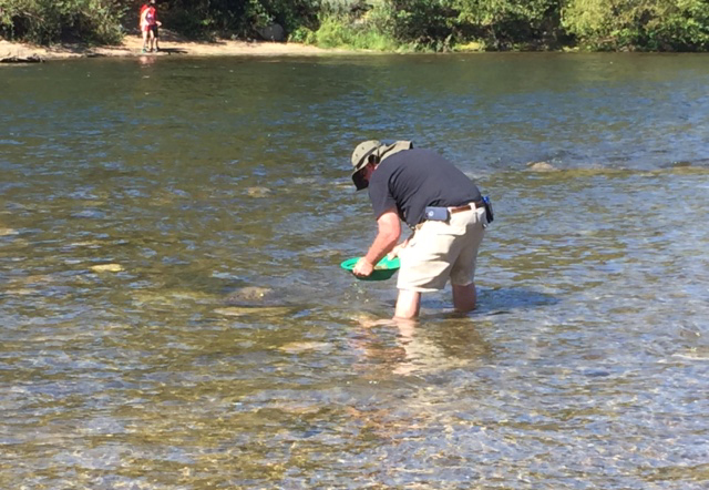 John Cook panning for gold in the American River.