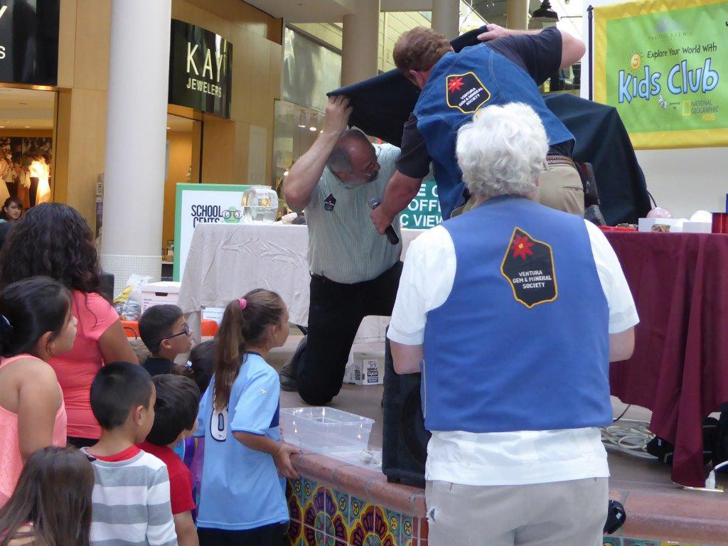 At the Pacific View Mall, kids rushed forward to see fluorescent minerals glow in the dark during our "Amazing Mineral Magic Show."